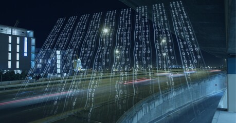 Composition of binary coding over cityscape at night