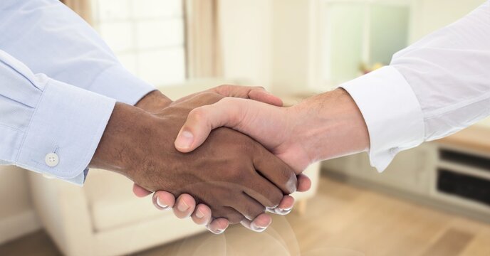 Composition of businessmen shaking hands