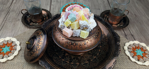 Traditional Turkish Delight, Turkish Sweet Sugar Ramadan (Ramadan) Dishes. Presentation on an antique plate.
