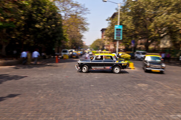 Image of a moving cab in the Indian city of Mumbai taken with motion blur