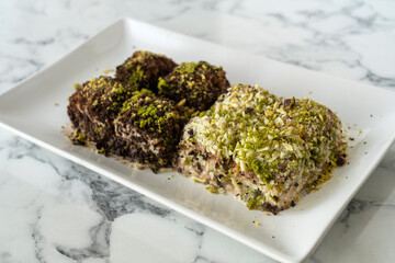 Traditional turkish new dessert cold milky baklava with pistachio