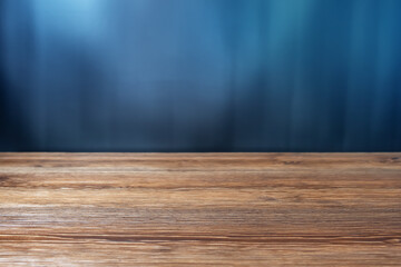 Vintage wooden table on blue background