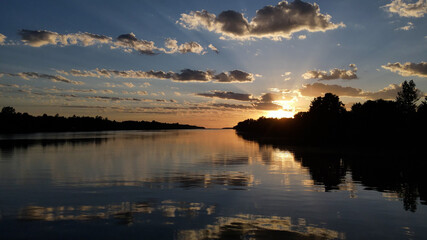 River and sky reflected on the water at sunset