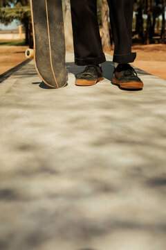 Close up of the feet of a young skateboarder
