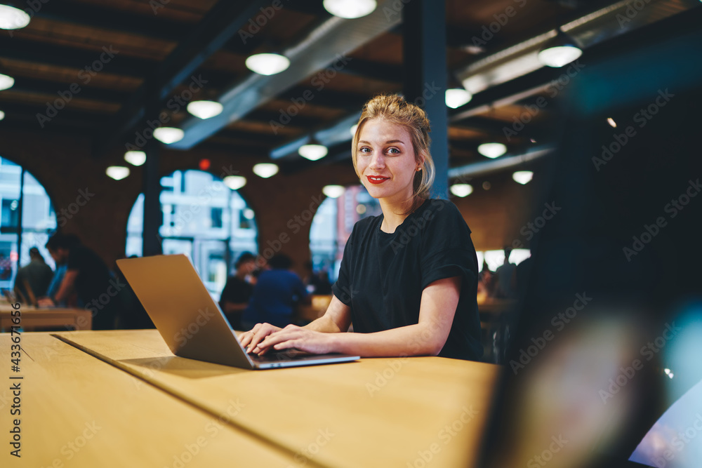 Poster portrait of skilled software developer 20s looking at camera during time for digital projecting via 