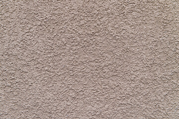 ベージュ色の漆喰の壁面