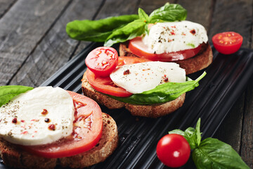 Open caprese sandwiches.