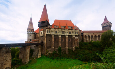 Fototapeta na wymiar Impressive landscape with medieval Corvin Castle on elevated rock, Hunedoara, Romania
