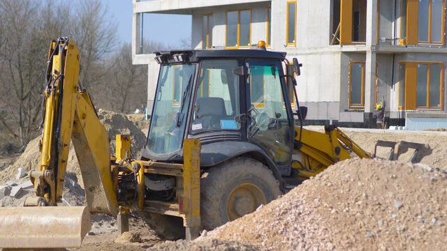 Excavator on the construction site in 4K Slow motion 60fps