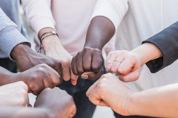 Group of cropped unrecognizable multiethnic protesters standing with clenched fist during Black Lives Matter demonstration
