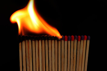 The matches stand close to one another and light up in turn