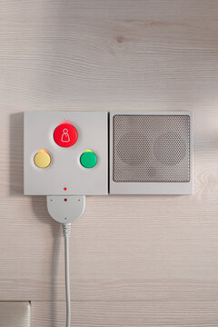 Close up of nurse call system with emergency buttons installed near bed in medical room in hospital