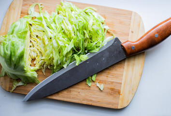 Young sliced cabbage on a wooden board
