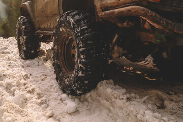 Dirty cars and wheels in the mountains. Swamp on the tires. Trips offroad across Ukraine. View of the Carpathian Mountains.