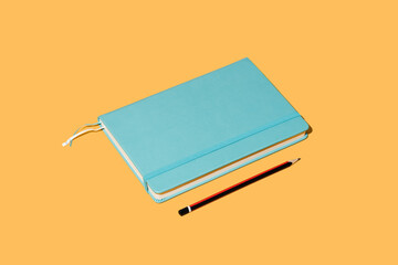 Vector illustration of notepad bookmark and pencil for taking notes on bright orange background