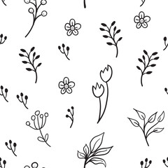 Floral and herbal ornaments seamless pattern. Hand drawn leaves and branches texture background. Nature doodles decoration.