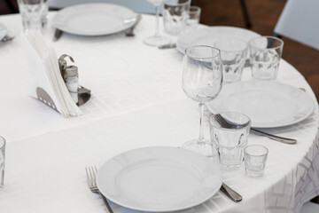 Wedding. Banquet. Table for guests, are served with cutlery and crockery and covered with a tablecloth.
