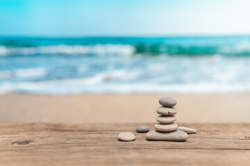 Pyramid of stones on the sea coast. Balance and harmony. Rest by the sea.