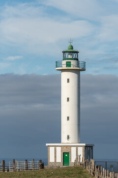 White lighthouse placed in Faro de Lastres in Asturias in Spain under cloudless blue sky in daytime