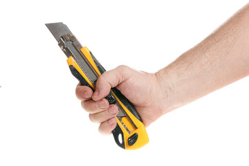 Hand holds a construction knife on a white background, a template for designers.