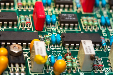 Electronics repair service, repairman fixes an electronic circuit, text space.
