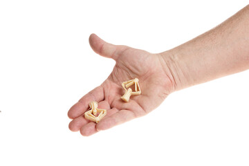 Hand holds a plastic dowel for screws on a white background