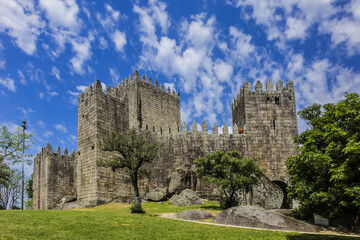 Fototapeta na wymiar Castle of Guimaraes - medieval castle in the municipality Guimaraes, in the northern region of Portugal. It built under the orders of Mumadona Dias in X century.