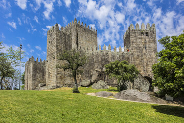 Fototapeta na wymiar Castle of Guimaraes - medieval castle in the municipality Guimaraes, in the northern region of Portugal. It built under the orders of Mumadona Dias in X century.