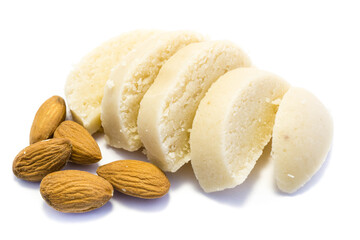 Piece of marzipan with almonds isolated on white background