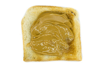 Toasted bread with peanut butter isolated on white background top view