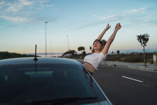 Leaning out of car