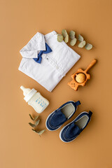 Set of baby boy accessories with milk bottle