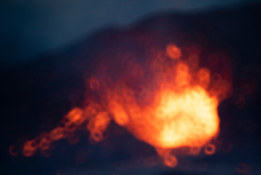 Blur close-up Fagradalsfjall volcano erupting in Iceland between clouds of smoke