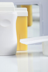 A yellow resin with heater reflected from a mirror with resin papers.