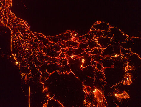 From above the magma of the volcano runs in the form of rivers of lava across the ground in Iceland