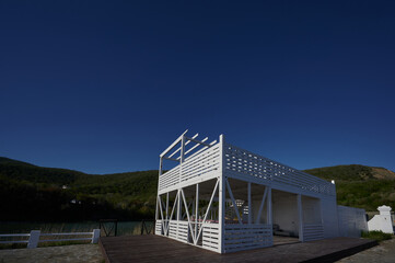 wooden structure under a cafe on the lake