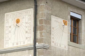 sundial on a house in old city of Nyon, canton of Vaud in Switzerland - obrazy, fototapety, plakaty