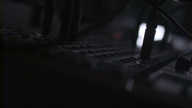 Music Producer checking his amp levels