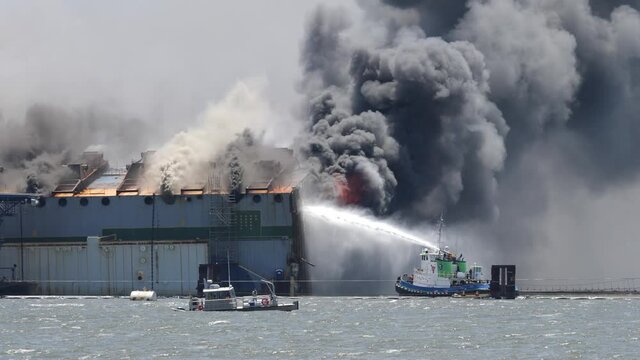 St Simons Island, GA USA - May 14 2021: Fire breaks out during demolition of Golden Ray cargo ship in the St. Simons Sound