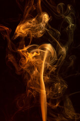 Fototapeta premium Multicolor Smoke painting on Black Background. Abstract.