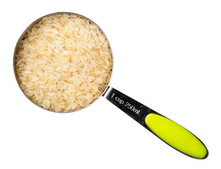 parboiled rice in measuring cup cutout on white