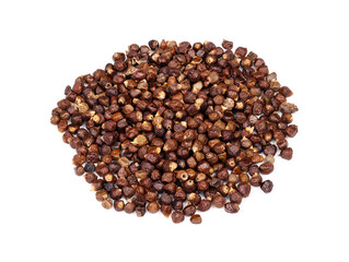 pile of grains of paradise pepper closeup on white