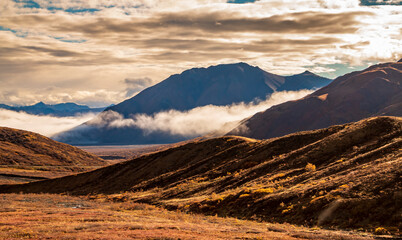 dramatic landscape of  mountain peaks and mountain ranges inside Denali National Park  during...