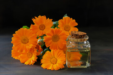 Aromatherapy essential oil with marigold flowers - Calendula officinalis

