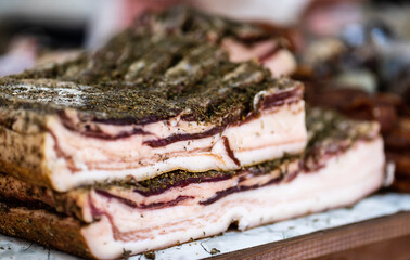 Close up view of delicious bacon with seasoning