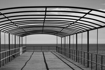 Architecture Abstract Background With Geometric Linear Pattern From Metalwork Or Framework And Black Parallel Shadows In Perspective View. Sundeck Pier Without Tent On The Sea Beach. 