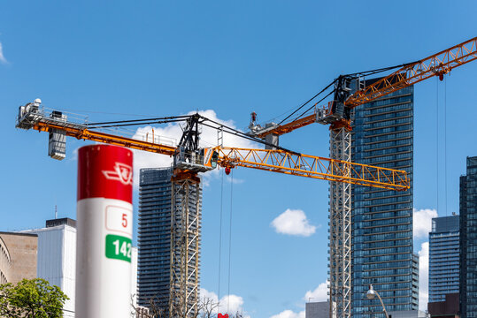 Construction Site in Toronto, Canada. The image is framed in a Toronto Transit Commission stop sign. 