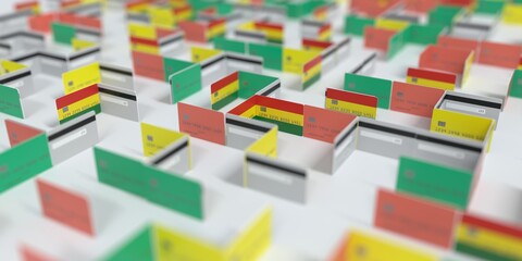Flag of Bolivia on the mockup credit card maze. Financial difficulties related 3D rendering