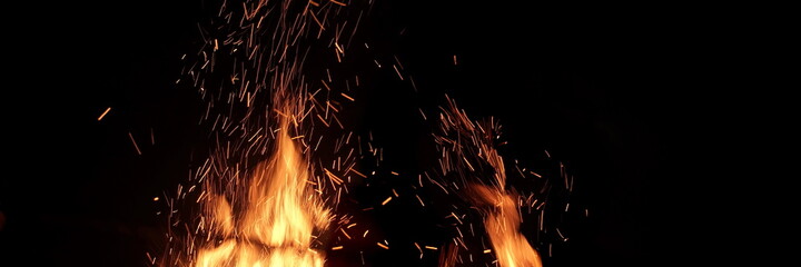 Flames Of Fire And Sparks Isolated On Black Background. Abstract Flaming Background. Magic Fiery...
