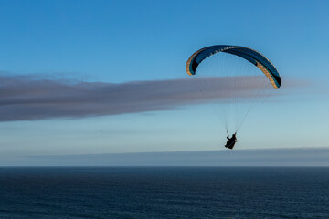 Bay Area Paraglider Soaring over Pacific Ocean at Sunset